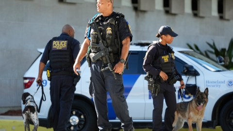 Department of Homeland Security officers patrol outside the Paul G. Rogers Federal Building and U.S. Courthouse, where Ryan Wesley Routh, 58, suspected in an apparent assassination attempt targeting former President Donald Trump, will be attending a hearing, Monday, Sept. 23, 2024, in West Palm Beach, Fla. (AP Photo/Wilfredo Lee)