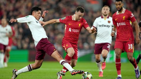 West Ham's Edson Alvarez, left, vies for the ball with Liverpool's Diogo Jota during the English League Cup soccer match between Liverpool and West Ham United at Anfield Stadium, Liverpool, England, Wednesday, Sept. 25, 2024. (AP Photo/Jon Super)