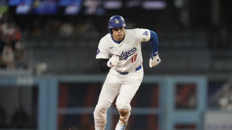 Los Angeles Dodgers' Shohei Ohtani runs to third base, advancing from second off a flyout by Freddie Freeman during the sixth inning of a baseball game against the San Diego Padres, Thursday, Sept. 26, 2024, in Los Angeles. (AP Photo/Ashley Landis)