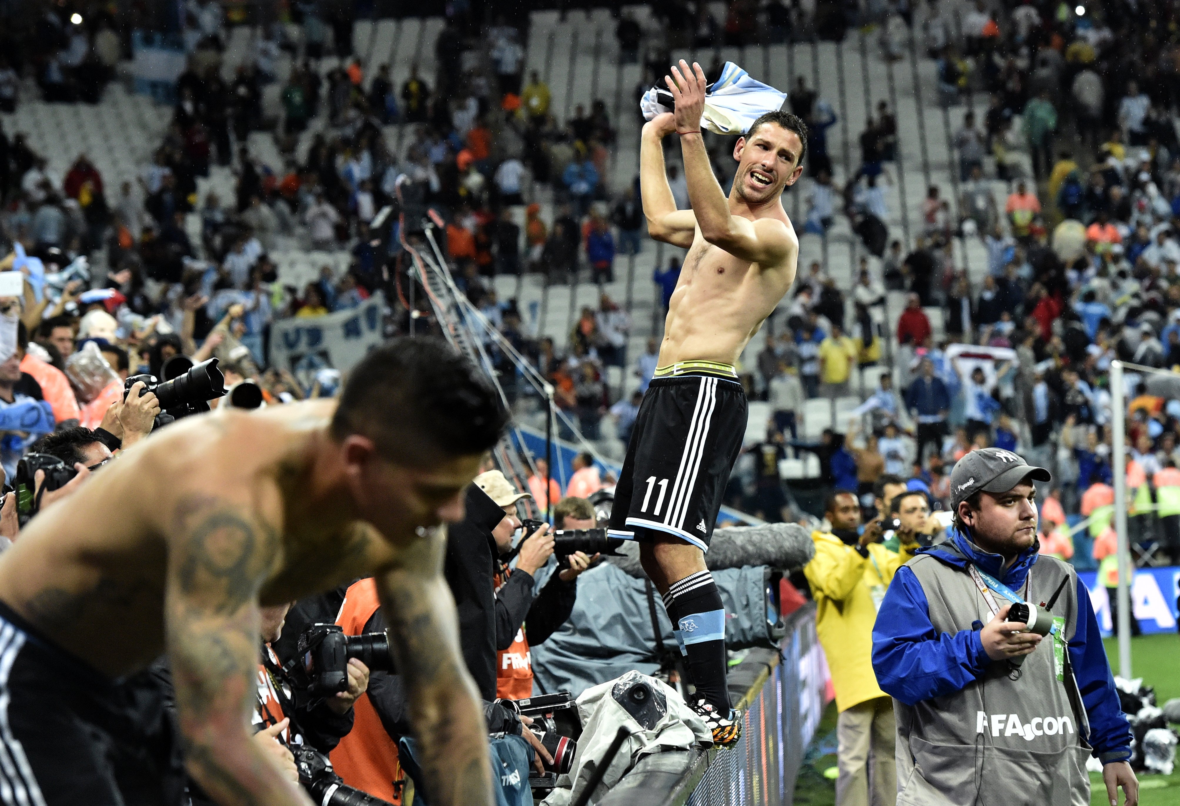 Argentina's Maxi Rodriguez celebrates after a shootout at the end of the World Cup semifinal soccer match between the Netherlands and Argentina at the Itaquerao Stadium in Sao Paulo Brazil, Wednesday, July 9, 2014. Argentina won 4-2 on penalties after the match ended 0-0 after extra time. (AP Photo/Martin Meissner)