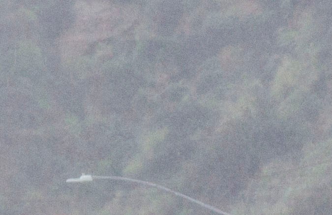 A Los Angeles County Sheriff's deputy investigates the scene of a collision involving three vehicles in Malibu, Calif. on Saturday, Feb. 7, 2015. Officials said former Olympian Bruce Jenner was a passenger in one of the cars involved in the Pacific Coast Highway crash that killed one person. Jenner's publicist, Alan Nierob, says Jenner was unhurt. (AP Photo/Ringo H.W. Chiu)