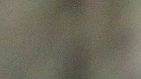 A woman stands outside a school being used as an evacuation center in preparation for Typhoon Hagupit in Legazpi, Albay province, eastern Philippines, Saturday, Dec. 6, 2014. Typhoon Hagupit slammed into the central Philippines' east coast late Saturday, knocking out power and toppling trees in a region where 650,000 people have fled to safety, still haunted by the massive death and destruction wrought by a monster storm last year. (AP Photo/Aaron Favila)