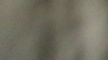 A woman stands outside a school being used as an evacuation center in preparation for Typhoon Hagupit in Legazpi, Albay province, eastern Philippines, Saturday, Dec. 6, 2014. Typhoon Hagupit slammed into the central Philippines' east coast late Saturday, knocking out power and toppling trees in a region where 650,000 people have fled to safety, still haunted by the massive death and destruction wrought by a monster storm last year. (AP Photo/Aaron Favila)