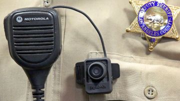 FILE - This Sept. 22, 2014 file photo shows a body camera on the uniform of a Los Angeles County Sheriff's deputy at department headquarters in Monterey Park, Calif. The largest sheriff's department in the U.S. doesn't have a policy for body cameras after years of studying the issue. So hundreds, and perhaps thousands, of deputies have taken matters into their own hands and purchased the cameras themselves. The camera shown may not be the type that deputies are currently buying on their own. (AP Photo/ Nick Ut, File)