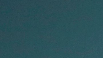 In this Wednesday, March 25, 2015, photo, Internal Revenue Service Special Agent In Charge Jonathan Larsen, holds a Smith & Wesson .38 Special during an interview in Mountainside, N.J. The gun belonged to IRS investigator Michael Malone, the man who went undercover to infiltrate Al Capones gang in the 1930s and eventually brought down the feared mobster. (AP Photo/Julio Cortez)