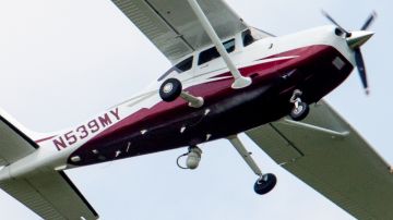 FILE - In this May 26, 2015, file photo, a small plane flies near Manassas Regional Airport in Manassas, Va. The plane is among a fleet of surveillance aircraft by the FBI, which are primarily used to target suspects under federal investigation. The FBI assured Congress on June 17, in an unusual, confidential briefing that its plane surveillance program is a by-the-books operation short on high-definition cameras, with some planes equipped with binoculars. (AP Photo/Andrew Harnik)