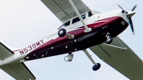 FILE - In this May 26, 2015, file photo, a small plane flies near Manassas Regional Airport in Manassas, Va. The plane is among a fleet of surveillance aircraft by the FBI, which are primarily used to target suspects under federal investigation. The FBI assured Congress on June 17, in an unusual, confidential briefing that its plane surveillance program is a by-the-books operation short on high-definition cameras, with some planes equipped with binoculars. (AP Photo/Andrew Harnik)