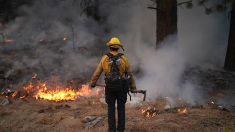 A firefighter works to contain the Bridge Fire Wednesday, Sept. 11, 2024, Wrightwood, Calif. (AP Photo/Eric Thayer)