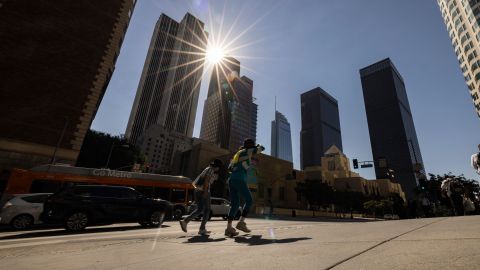 The sun shines over the financial district towers of downtown Los Angeles as Southern California is hit by a heatwave Friday, Sept. 6, 2024, in Los Angeles. (AP Photo/Etienne Laurent)