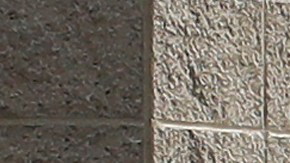 FILE - In this Feb. 20, 2020, file photo, pedestrians walk past a Pacific Gas and Electric sign at a PG&E location in San Francisco. Pacific Gas & Electric will face another legal challenge to a $13.5 billion settlement with more than 80,000 Northern California victims worried they're being shortchanged in a deal that's supposed to repay them for losses caused by the utility's negligence. (AP Photo/Jeff Chiu, File)