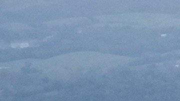 An aerial view of flood damage left by Hurricane Helene along the Nolichucky River, Saturday, Sept. 28, 2024, in Greene County, Tenn. (AP Photo/George Walker IV)