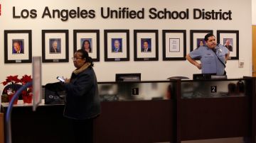 Los Angeles Unified School District Superintendent Austin Beutner, pictured far left, along with other LAUSD Board members at their headquarters lobby in Los Angeles Friday, Jan. 11, 2019. A massive teachers strike in Los Angeles is still planned for Monday, Jan. 14, after a union rejected a new offer from the nation's second-largest school district and declared an impasse following 21 months of increasingly heated negotiations. After hours of new talks Friday, the union representing teachers in the Los Angeles Unified School District announced that the new offer was "woefully inadequate." (AP Photo/Damian Dovarganes)