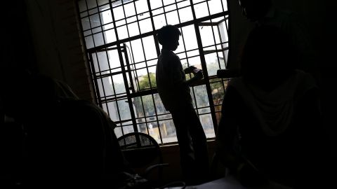A young Indian bonded child laborer waits to be processed after being rescued during a raid by workers from Bachpan Bachao Andolan, or Save the Childhood Movement, in New Delhi, India, Wednesday, July 11, 2012. In New Delhi alone, about 50,000 children are believed to be working in factories, with thousands more begging on the streets and sorting garbage. India recently passed a law aimed at fighting child labor by making education compulsory up to age 14 but grinding poverty still leads many kids to work, and certain industries that involve intricate machinery or delicate handiwork prefer their smaller hands. (AP Photo/Kevin Frayer) INDIA OUT