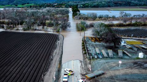 FILE - Floodwaters cover South Davis Rd. near Salinas in Monterey County, Calif., as the Salinas River overflows its banks on Jan. 13, 2023. California officials announced on Thursday, Jan. 26, 2023, that public water agencies will get 30% of what they asked for instead of 5%. The increase is because of a spate of recent storms that have helped replenish some of the state's reservoirs that had been impacted by a severe drought. (AP Photo/Noah Berger, File)