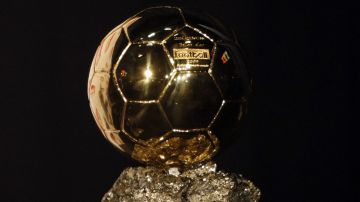 The 'Ballon d'Or' or Golden Ball award received by FC Barcelona's Lionel Messi, from Argentina, is seen during a photocall, in Paris Sunday, Dec. 6, 2009. Messi received the Ballon d'Or, the prize awarded to the Europe-based footballer of the year on Sunday following an exceptional season with Barcelona. (AP Photo/Francois Mori)