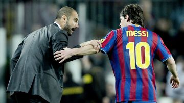 FC Barcelona's Lionel Messi from Argentina, right, chats with his coach Josep Guardiola after he scored against Athletic Bilbao during their Spanish La Liga soccer match at the Camp Nou stadium in Barcelona, Spain, Saturday, April 03, 2010. (AP Photo/David Ramos)