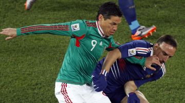 Mexico's Guillermo Franco, left, and France's Franck Ribery vie for the ball during the World Cup group A soccer match between France and Mexico at Peter Mokaba Stadium in Polokwane, South Africa, Thursday, June 17, 2010. (AP Photo/Hassan Ammar)