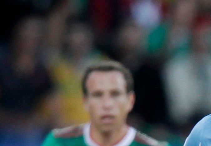 Mexico's Guillermo Franco, center is caught between Uruguay's Jorge Fucile, left, and Uruguay's Diego Perez during the World Cup group A soccer match between Mexico and Uruguay at Royal Bafokeng Stadium in Rustenburg, South Africa, on Tuesday, June 22, 2010. (AP Photo/ )