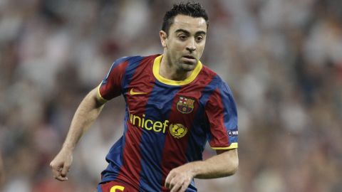 FC Barcelona's Xavi Hernandez controls the ball during a semi final, 1st leg Champions League soccer match against Real Madrid in the Santiago Bernabeu stadium in Madrid Wednesday April 27, 2011. (AP Photo/Paul White)