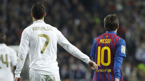 Real Madrid's Cristiano Ronaldo from Portugal, left, gestures beside FC Barcelona's Lionel Messi from Argentina, right, during their quarter finals, first leg, Copa del Rey soccer match at the Santiago Bernabeu stadium in Madrid, Spain, Wednesday, Jan. 18, 2012. (AP Photo/Andres Kudacki)