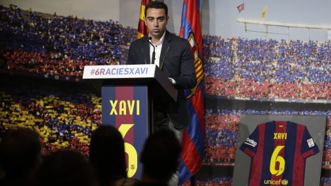 FC Barcelona Xavi Hernandez speaks during his farewell event at the Camp Nou stadium in Barcelona, Spain, Wednesday, June 3, 2015. FC Barcelona midfielder Xavi Hernandez says he will leave the Catalan club after 17 trophy-laden seasons in which he set club records for appearances and titles won. The 35-year-old Xavi says he will cut his contract short by one year and leave after this season to go play for Qatari club Al-Sadd on a two-year contract. (AP Photo/Manu Fernandez)