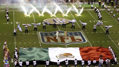 FILE - In this Oct. 2, 2005, file photo, performers are shown prior to the start of a regular season NFL game between the Arizona Cardinals and San Francisco 49ers at Azteca Stadium in Mexico City, Mexico. Eleven years after the network telecast an NFL game from Mexico City, it will do so again when the Raiders "host" the Texans on Monday night. (AP Photo/Marco Ugargte, File)