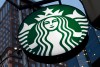 FILE - This June 26, 2019 file photo shows a Starbucks sign outside a Starbucks coffee shop in downtown Pittsburgh. Starbucks Corp. reports financial earns on Wednesday, Oct. 30. (AP Photo/Gene J. Puskar, File)