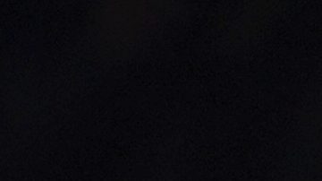 Mexican Formula One Red Bull driver Sergio "Checo" Perez waves as he holds his nation's flag after an exhibition race along Paseo de la Reforma ahead of this weekend's Mexico Grand Prix in Mexico City, Wednesday, Nov. 3, 2021. (AP Photo/Fernando Llano)