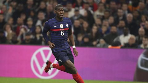 France's Paul Pogba runs with the ball during an international friendly soccer match between France and Cote d'Ivoire at the Velodrome stadium in Marseille, southern France, Friday, March 25, 2022. (AP Photo/Daniel Cole)