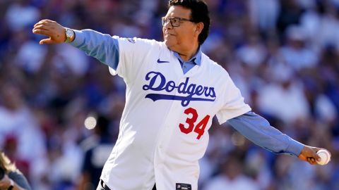 FILE - Former Los Angeles Dodgers pitcher Fernando Valenzuela throws the ceremonial first pitch during the MLB All-Star baseball game, July 19, 2022, in Los Angeles. The Dodgers will retire the No. 34 jersey of Valenzuela during a three-day celebration this summer. (AP Photo/Abbie Parr, File)