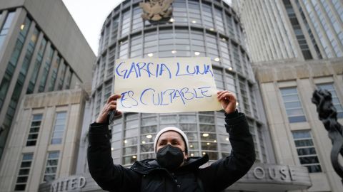 A demonstrators holds a sign that reads "GARCIA LUNA ES CULPABLE," or "GARCIA LUNA IS GUILTY" outside federal court moments before Genaro García Luna was found guilty of taking massive bribes to protect the violent drug cartels he was tasked with combating, Tuesday, Feb. 21, 2023, in New York. Luna headed Mexico's federal police and then was its top security official from 2006 to 2012. (AP Photo/John Minchillo)