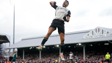 Fulham's Raul Jimenez celebrates after scoring his side's first goal during the English Premier League soccer match between Arsenal and Fulham at Craven Cottage stadium in London, Sunday, Dec. 31, 2023. (AP Photo/Alastair Grant)