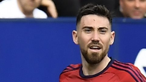 Real Madrid's David Alaba is fouled by Osasuna's Lucas Torrom during the Spanish La Liga soccer match between Osasuna and Real Madrid at the El Sadar stadium in Pamplona, Spain, Saturday, March 16, 2023. (AP Photo/Alvaro Barrientos)