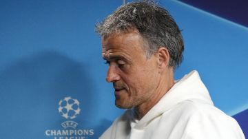 PSG's head coach Luis Enrique leaves at a press conference prior the Champions League semifinal first leg soccer match between Borussia Dortmund and Paris Saint-Germain at the Signal-Iduna Park in Dortmund, Germany, Tuesday, April 30, 2024. (AP Photo/Martin Meissner)