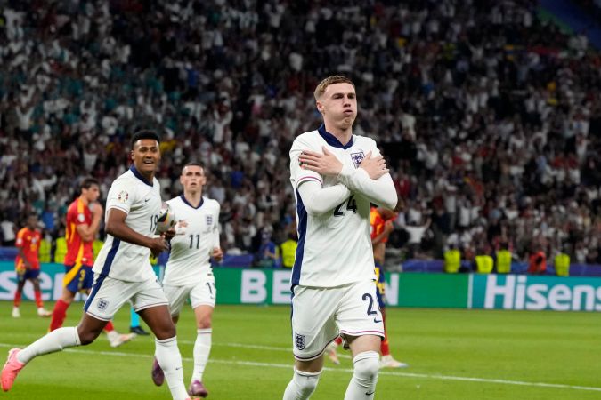 England's Cole Palmer celebrates after scoring his side's opening goal during the final match between Spain and England at the Euro 2024 soccer tournament in Berlin, Germany, Sunday, July 14, 2024. (AP Photo/Frank Augstein)