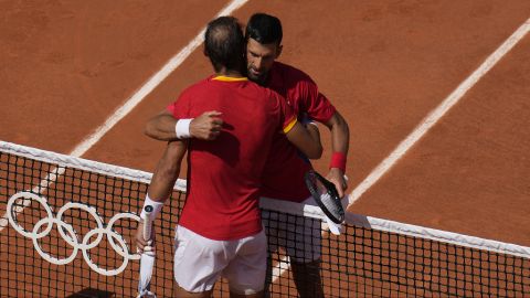 Serbia's Novak Djokovic, right, hugs Spain's Rafael Nadal after their men's singles second round match at the Roland Garros stadium at the 2024 Summer Olympics, Monday, July 29, 2024, in Paris, France. Novak Djokovic dominated rival Rafael Nadal to win 6-1, 6-4 at the Paris Olympics in the second round. (AP Photo/Manu Fernandez)