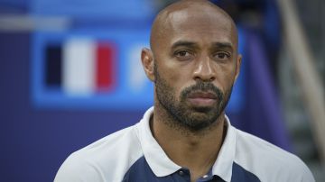 France's head coach Thierry Henry looks on prior to the men's semifinal soccer match between France and Egypt, at Lyon Stadium, during the 2024 Summer Olympics, Monday, Aug. 5, 2024, in Decines, France. (AP Photo/Laurent Cipriani)