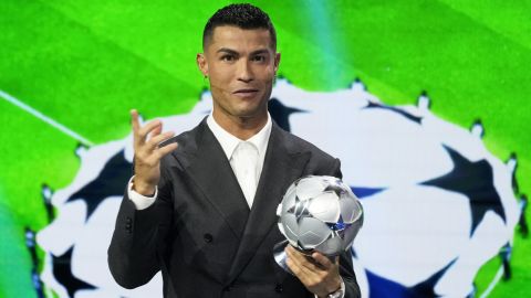 Cristiano Ronaldo, the all-time leading goalscorer in the Champions League, speaks after receiving a special award from UEFA President Aleksander Ceferin in recognition of his achievements in the competition, during the Champions League, league phase, draw, in Monaco, Thursday, Aug. 29, 2024. (AP Photo/Gregorio Borgia)