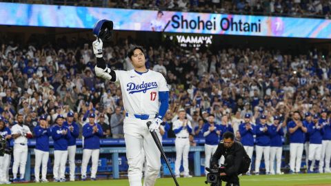 Los Angeles Dodgers designated hitter Shohei Ohtani (17) is honored during the first inning of a baseball game against the Colorado Rockies in Los Angeles, Friday, Sept. 20, 2024. Ohtani was the first MLB player to achieve 50 home runs and 50 stolen bases in a single season. (AP Photo/Ashley Landis)