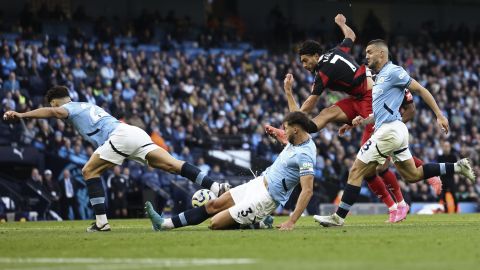 From left, Manchester City's Josko Gvardio, Ruben Dias, and Mateo Kovacic challange Fulham's Raul Jimenez during the English Premier League soccer match between Manchester City and Fulham at Etihad Stadium in Manchester, England, Saturday, Oct. 5, 2023. (AP Photo/Darren Staples)