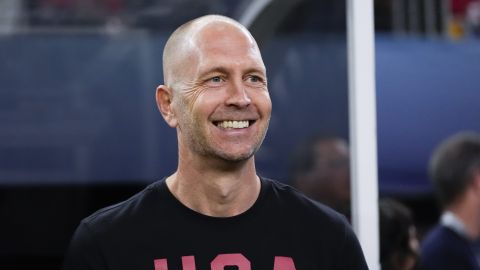 FILE - United States head coach Gregg Berhalter smiles from the bench before a CONCACAF Nations League final soccer match against Mexico, Sunday, March 24, 2024, in Arlington, Texas. (AP Photo/Tony Gutierrez )