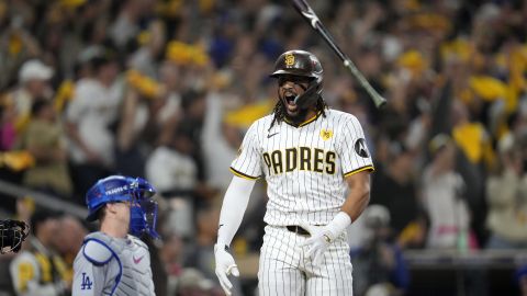 San Diego Padres' Fernando Tatis Jr. tosses his bat after hitting a two-run home run during the second inning in Game 3 of a baseball NL Division Series against the Los Angeles Dodgers, Tuesday, Oct. 8, 2024, in San Diego. (AP Photo/Ashley Landis)