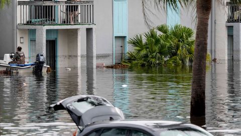 People await being rescued from an apartment complex in the aftermath of Hurricane Milton, Thursday, Oct. 10, 2024, in Clearwater, Fla. (AP Photo/Mike Stewart)