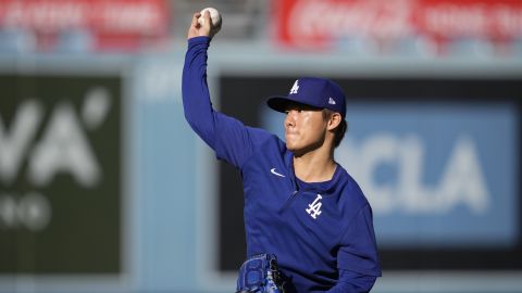 Los Angeles Dodgers pitcher Yoshinobu Yamamoto throws on the field ahead of Game 5 of a baseball NL Division Series between the Los Angeles Dodgers and the San Diego Padres, Thursday, Oct. 10, 2024, in Los Angeles. (AP Photo/Ashley Landis)