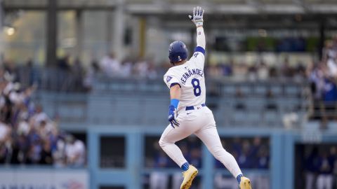 Los Angeles Dodgers' Kiké Hernández celebrates as he rounds second base following his solo home run during the second inning in Game 5 of a baseball NL Division Series against the San Diego Padres, Friday, Oct. 11, 2024, in Los Angeles. (AP Photo/Mark J. Terrill)