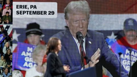 An image of Republican presidential nominee former President Donald Trump appears on screen as Democratic presidential nominee Vice President Kamala Harris speaks during a campaign rally at Erie Insurance Arena, in Erie, Pa., Monday, Oct. 14, 2024. (AP Photo/Jacquelyn Martin)