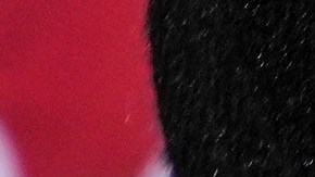 Ann McDonald of Rutherfordton, shows off her display of political buttons in support of the Republican ticket, former President Trump, Lt. Gov. Mark Robinson and Hal Weatherman, Thursday, Oct. 17, 2024, outside the Rutherford County Annex Building on the first day of early voting, in Rutherfordton, N.C. (AP Photo/Kathy Kmonicek)