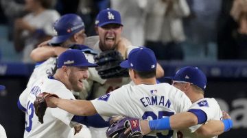 Los Angeles Dodgers celebrate their win against the New York Mets in Game 6 of a baseball NL Championship Series, Sunday, Oct. 20, 2024, in Los Angeles. The Dodgers will face the New York Yankees in the World Series. (AP Photo/Mark J. Terrill)