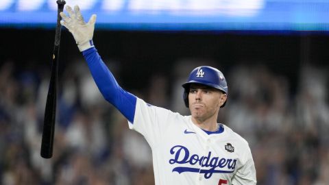 Los Angeles Dodgers' Freddie Freeman celebrates his walk-off grand slam home run against the New York Yankees during the 10th inning in Game 1 of the baseball World Series, Friday, Oct. 25, 2024, in Los Angeles. (AP Photo/Ashley Landis)