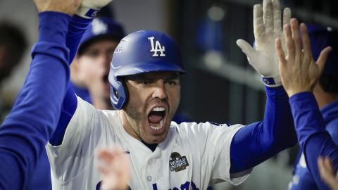 Los Angeles Dodgers' Freddie Freeman celebrates his home run against the New York Yankees during the third inning in Game 2 of the baseball World Series, Saturday, Oct. 26, 2024, in Los Angeles. (AP Photo/Ashley Landis)